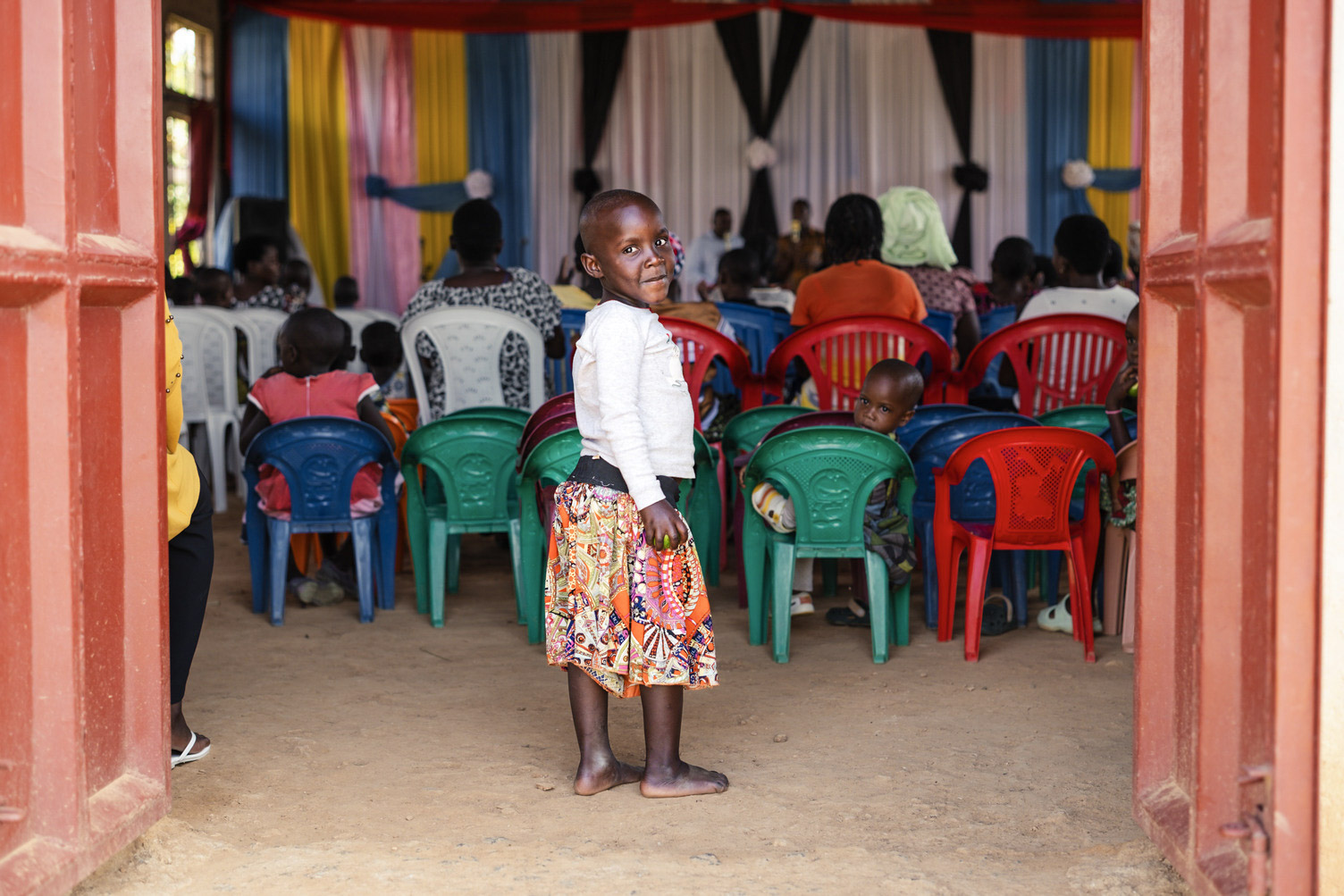 Tanzania The church furniture consisted of plastic chairs in various colors, with the Swahili phrase Mungu ni Mwema